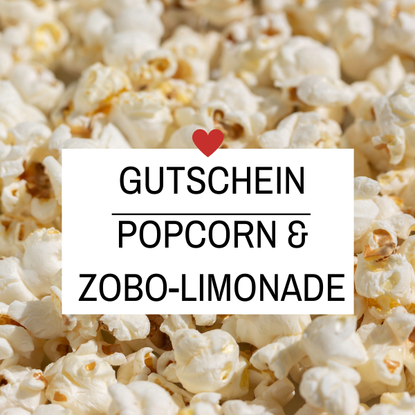 Kinogutschein mit Popcorn und Limonade als Geschenk verpackt